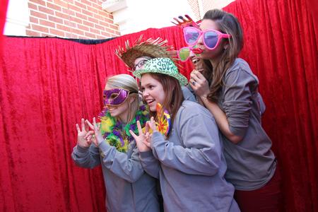 A group of students enjoy the photo booth available at the Union Strong event during homecoming weekend. - Photo by Matt McDaniel