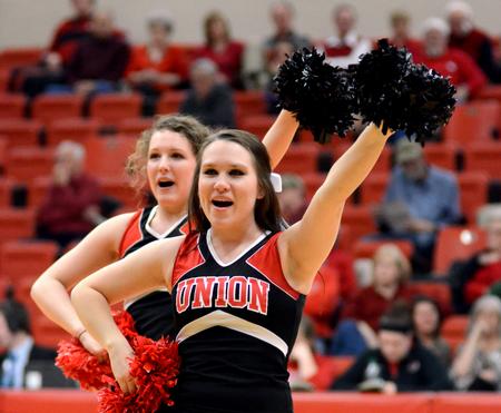 Cheerleaders Rachel Carver and April Coleson cheer for the Bulldogs basketball team as they take on Christian Brothers University.  - Photo by Anne Richoux