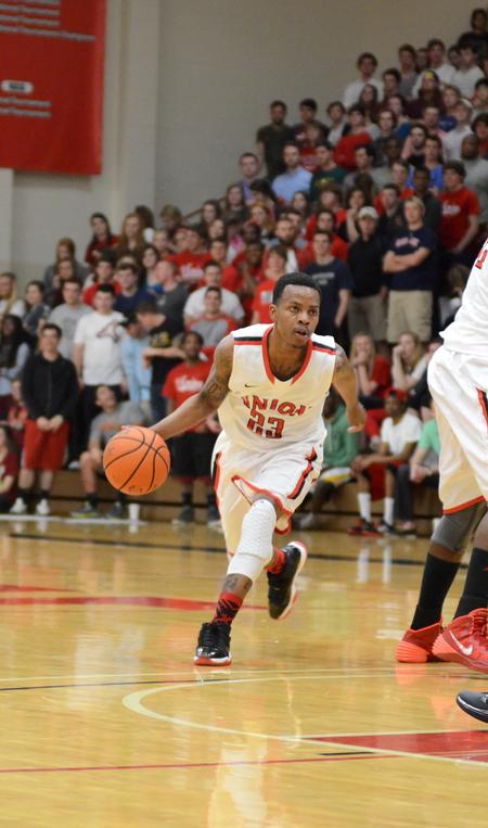 Bulldog Corieon Pearson drives down the court during the homecoming game against Delta State in the Fred DeLay Gymnasium.  - Photo by Anne Richoux