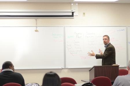 Justin Barnard, associate dean of the Institute for Intellectual Discipleship and associate professor of philosophy, teaches Introduction to Christian Ethics to graduate students in Jennings Hall.  - Photo by Anne Richoux