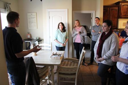 Blake Pennington, director of wellness services, hosts students at his house for Be Our Guest for dinner, corn hole, and roasting marshmallows. - Photo by Matt McDaniel