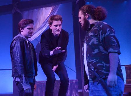 Peter Riggs, senior philosophy major, William Burke, senior music theory major, and Nick Hancock, sophomore history major, perform a scene from "Hamlet." - Photo by Amanda Rohde