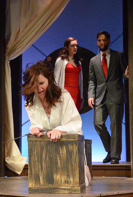 Elizabel Sartin, freshman music performance major, Allison Hearn, senior theatre major, and Jay Griffith, senior English and French major, perform a scene from Shakespeare's "Hamlet." - Photo by Amanda Rohde
