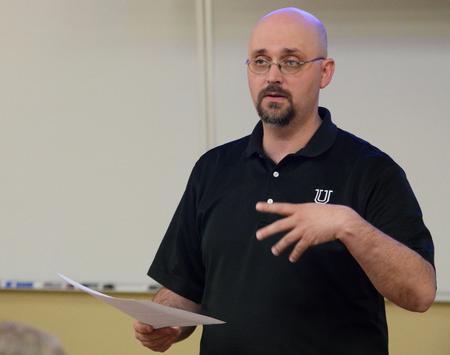 Joshua Veltman, associate professor of music history and literature, gives a lecture on "Congregational Singing in Reformation Germany"  as a part of the Town and Gown lecture series. - Photo by Anne Richoux