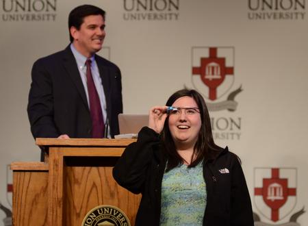 As a part of the lecture, Haley Mitchell experiments with using Google Glass during “An Exploration of Google Glass for Education" in the Grant Events Center. - Photo by Jacob Moore