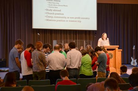 Prayers are sent up for students doing missions this summer after the GO Trip reports in chapel. - Photo by MiKalla Cotton