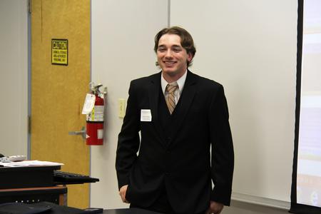 Grant Godel, senior business administration major, presents his project for the 11th Annual Union University Scholarship Symposium, where students share research and projects from the semester. - Photo by Matt McDaniel