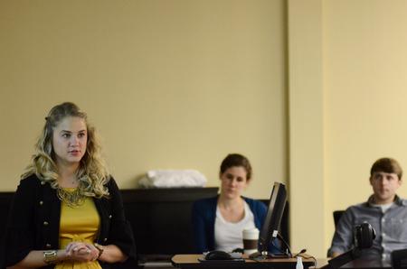 Morgan Kroeger, junior accounting major,answers a question following her presentation at the Scholarship Symposium. - Photo by Anne Richoux