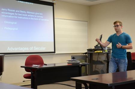 Grant Dew, senior Christian studies major, presents his project for the annual Scholarship Symposium in Jennings Hall. - Photo by MiKalla Cotton