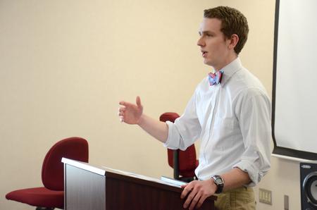 Caleb Valentine, senior Biblical studies and languages major, presents his project for the annual Scholarship Symposium. - Photo by MiKalla Cotton