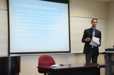 Caleb Creel, senior theology major, presents his project for the annual Scholarship Symposium in Jennings Hall. - Photo by MiKalla Cotton