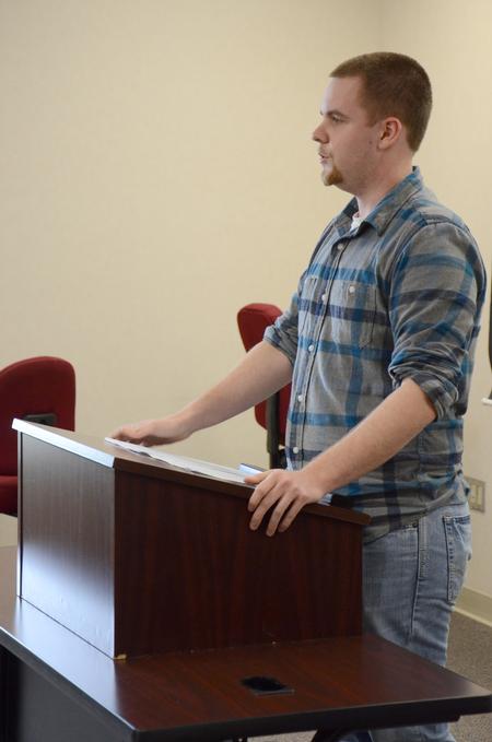 Brian Osborne, junior Christian studies major, presents his final project for the annual Scholarship Symposium in Jennings Hall. - Photo by MiKalla Cotton