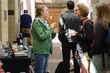 Megan Bailey, graduate assistant, talks with Naomi Pietenpol, junior mathematics major, and Grace Eaton, sophomore nursing major, during the Graduate Degrees Informational Fair in the SUB. - Photo by MiKalla Cotton