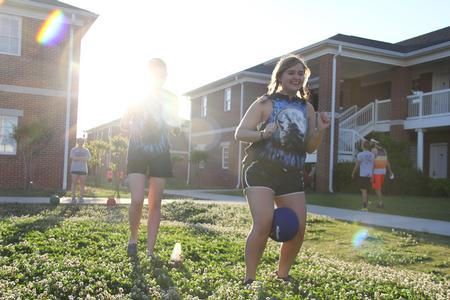 Stephanie Olford, freshman psychology major, races in the relay race during the Residence Life Field Day and House Cup Championship outside the Bowld Student Commons. - Photo by Matt McDaniel