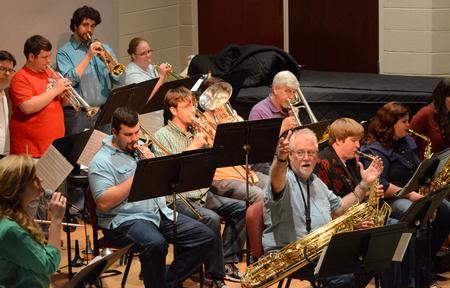 David McClune, university professor of music, directs the Jazz Band as they perform at their concert in Hartley Recital Hall. - Photo by MiKalla Cotton