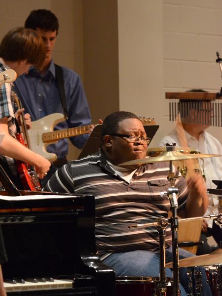 Ryan Nelson, freshman music education major, plays the drums during the Jazz Band concert. - Photo by MiKalla Cotton