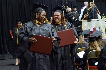 "We did it! We are graduated!" two graduates exclaimed to each other as they received their diplomas at the Spring Commencement Services. - Photo by MiKalla Cotton