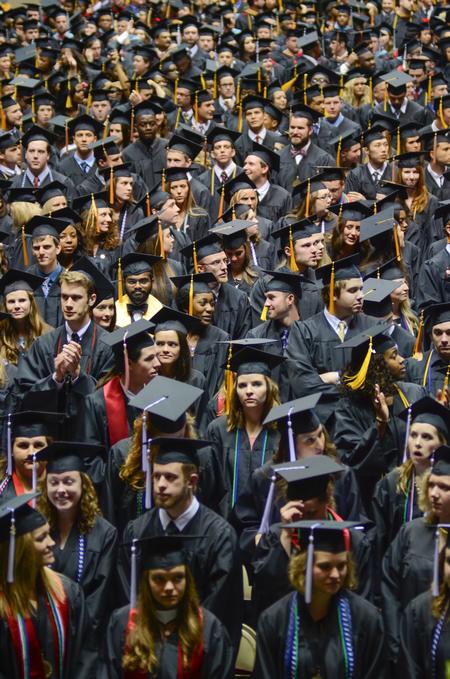 Graduates converse before being seated at the 189th Spring Commencement Services, held in the Oman Arena. - Photo by Meg Rushing
