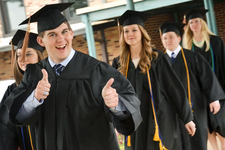 Paul Neal, business administration graduate, poses for the camera briefly before entering into Oman Arena for Union University's 189th Spring Commencement Ceremony. - Photo by Emily Stookey