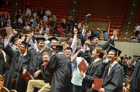 Members of the fraternity Sigma Alpha Epsilon celebrate with their brothers after the Spring Commencement Services. - Photo by Emily Stookey