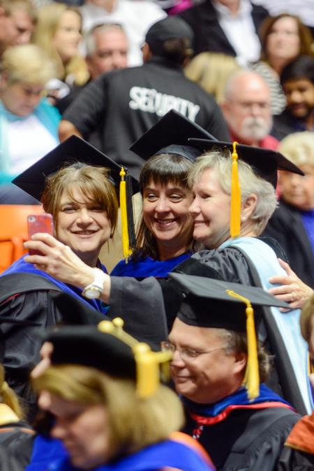 Faculty members Victoria Malone, Patricia Hamilton and Pam Sutton gather to take a photo at Union University’s 189th Spring Commencement. - Photo by Kathleen Murray