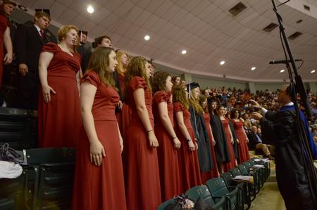 Union University Singers, including several graduating members, perform during the Spring Commencement Services at the Oman Arena. - Photo by Amanda Rohde