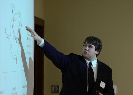 Joshua French, senior cell and molecular biology major, presents on the relationship between water chemistry and the presence of Eustronglides at the annual Scholarship Symposium. - Photo by Jacob Moore