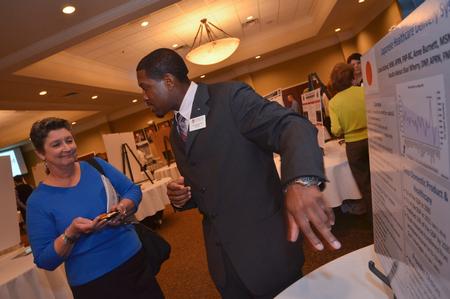 Carlos Buford goes over his presentation on the Japanese Healthcare System, in a  in-depth look at how it is run. - Photo by Morris Abernathy