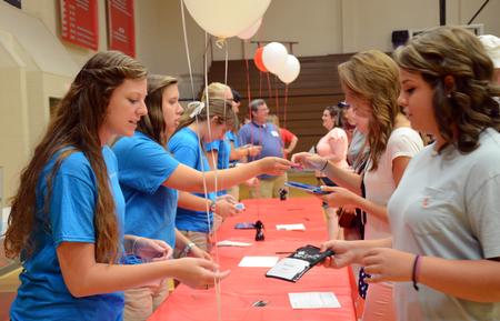 New students pick up their keys and fill out last-minute paperwork on move-in day. - Photo by Amanda Rohde