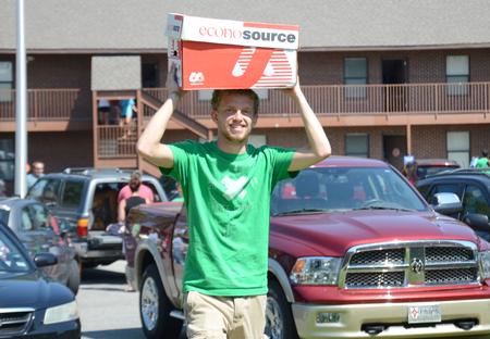 Anderson Underwood, sophomore English major, helps unload boxes for new students moving in. - Photo by Amanda Rohde