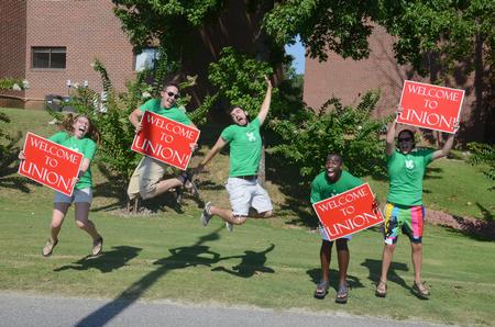 Life Group leaders energetically welcome new students as they drive onto campus for move-in day. - Photo by Emily Stookey