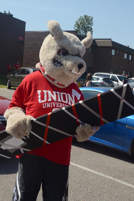 Buster the Bulldog assists students in carrying their belongings to their new rooms. - Photo by Emily Stookey