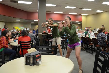 Life Group leaders, including Nick Fleming, senior Christian ministry and missions major, and Morgan Morfe, junior psychology major, surprise new students with a flash mob in the Brewer Dining Hall. - Photo by MiKalla Cotton