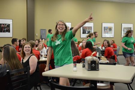 Life Group leaders, including Ruthie Johnson, junior Christian ministry and missions major, surprise new students with a flash mob in the Brewer Dining Hall. - Photo by MiKalla Cotton