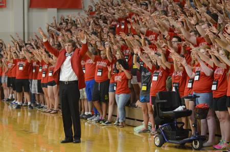Fred Fanatic Willie Louth, junior economics major, teaches the new students a cheer during the Focus Spirit Rally Run. - Photo by Emily Stookey