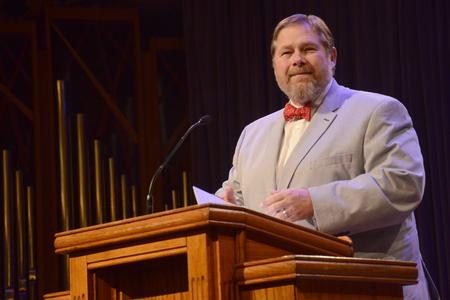 C. Ben Mitchell, provost and vice president for academic affairs, gives the prayer of dedication at the New Student and Parent Worship Service. - Photo by Emily Stookey