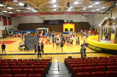 New students and student leaders enjoy games and inflatables at the SAC Focus Fest in the Fred DeLay Gymnasium. - Photo by Meg Rushing