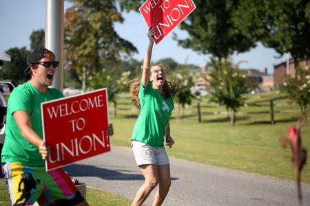 Life Group leaders excitedly welcome new students and their families for move-in day. - Photo by Kristi McMurry Woody