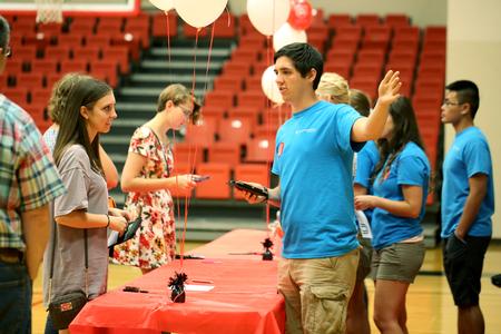 Resident advisors help students check in and get keys during new student move-in day. - Photo by Kristi McMurry Woody