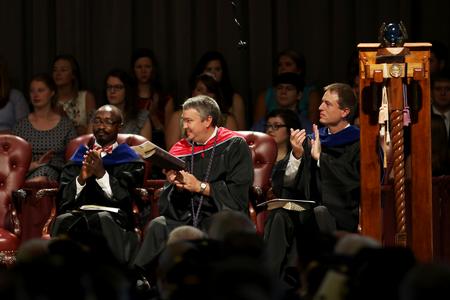 Richard Addo, Steven Aldridge and Chris Mathews clap during Fall Convocation. - Photo by Kristi McMurry Woody
