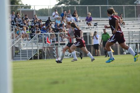 Lady Bulldog, Kayleigh Patterson, sophomore broadcast journalism major, brings the ball down the field in an exhibition game against Freed Hardeman University. - Photo by MiKalla Cotton