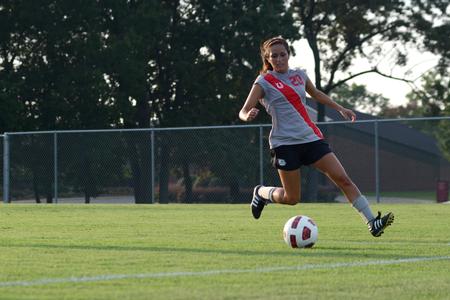 Lady Bulldog, Sara Johnson, senior nursing major, kicks the ball in the exhibition game against Freed Hardeman University. - Photo by MiKalla Cotton