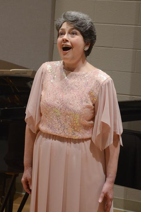 Soprano Georgia Wellborn, professor of music, sings "Mandoline" at her Faculty Voice Recital. - Photo by Emily Stookey