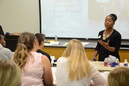 Renee Jones, associate director of the Vocatio Center for Life Calling and Career, speaks to students about career paths after college at the Backpack to Briefcase: Résumé Writing and Interviewing Skills Seminar. - Photo by MiKalla Cotton