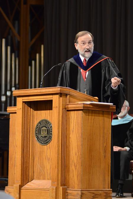 Faculty member of the year, Hal Poe, Chuck Colson professor of faith and culture, speaks in the G. M. Savage Memorial Chapel. - Photo by Emily Stookey