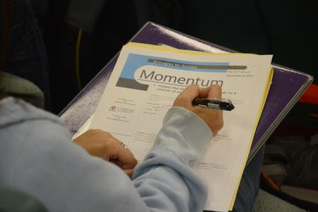 Students take notes during the Vocatio Center's Momentum seminar. - Photo by Emily Stookey