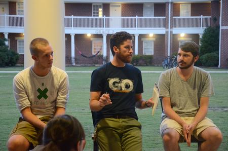 Lee Wilson, director of discipleship, welcomes students to a GO Week event to hear about 2014 summer GO Trips on the Bowld Student Commons patio. - Photo by Meg Rushing