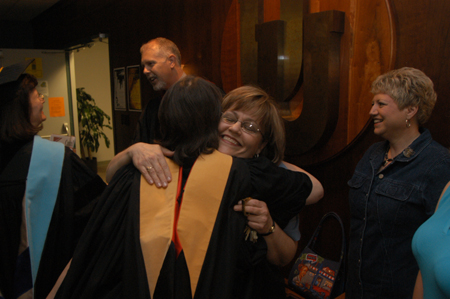 Helen Butler is congratulated for winning Staff Member of the Year shortly after Awards Day. - Photo by Jim Veneman