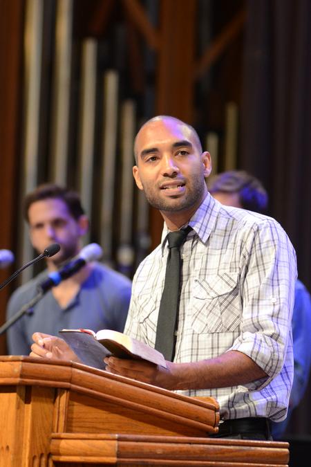 Matthew Marshall, director for service and diversity initiatives, reads a passage from Revelation 4 at the beginning of GO Week chapel service.  - Photo by Emily Stookey