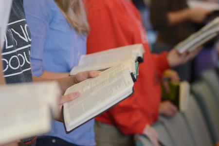 Students follow along as guest speaker D.A. Horton reads 1 Peter 2:9-10 at the second GO Week chapel service.  - Photo by Emily Stookey